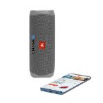 Gray JBL Flip 5 waterproof portable speaker with custom logo.